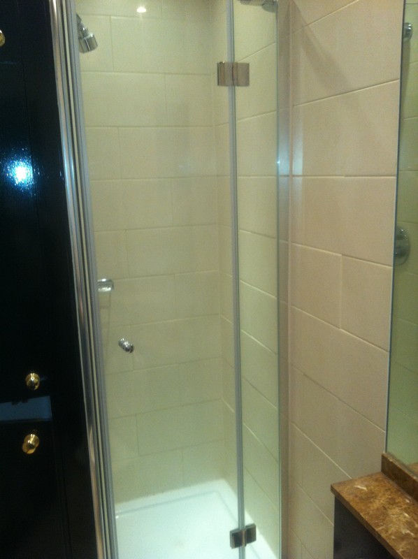 Frameless glass shower enclosure with chrome fittings in Belgravia